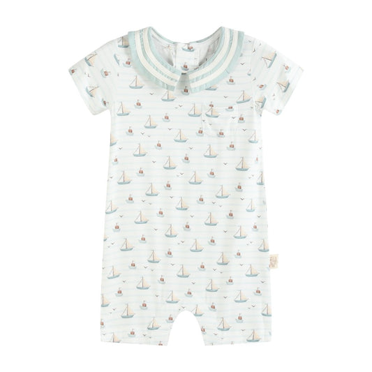 Baby romper with sailboat pattern on a white background