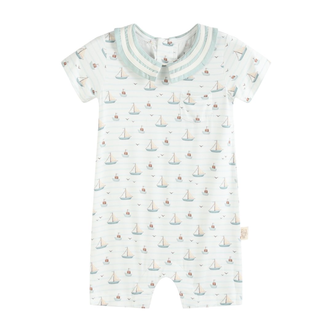 Baby romper with sailboat pattern on a white background