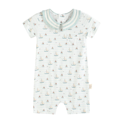 Baby romper with sailboat pattern on a white background